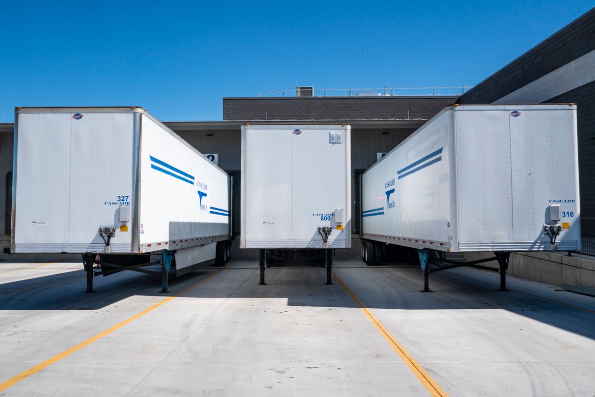 Warehouse floor cleaning services with industrial ride-on scrubber for Central Florida logistics facility